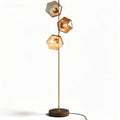 Modern floor lamp with three geometric glass shades and bronze finish